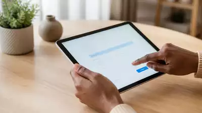 User submitting online form on tablet