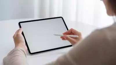 User submitting online form on tablet